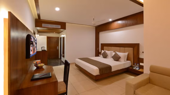 Air-conditioned room with modern amenities at Hotel Shree Rudraksh Somnath